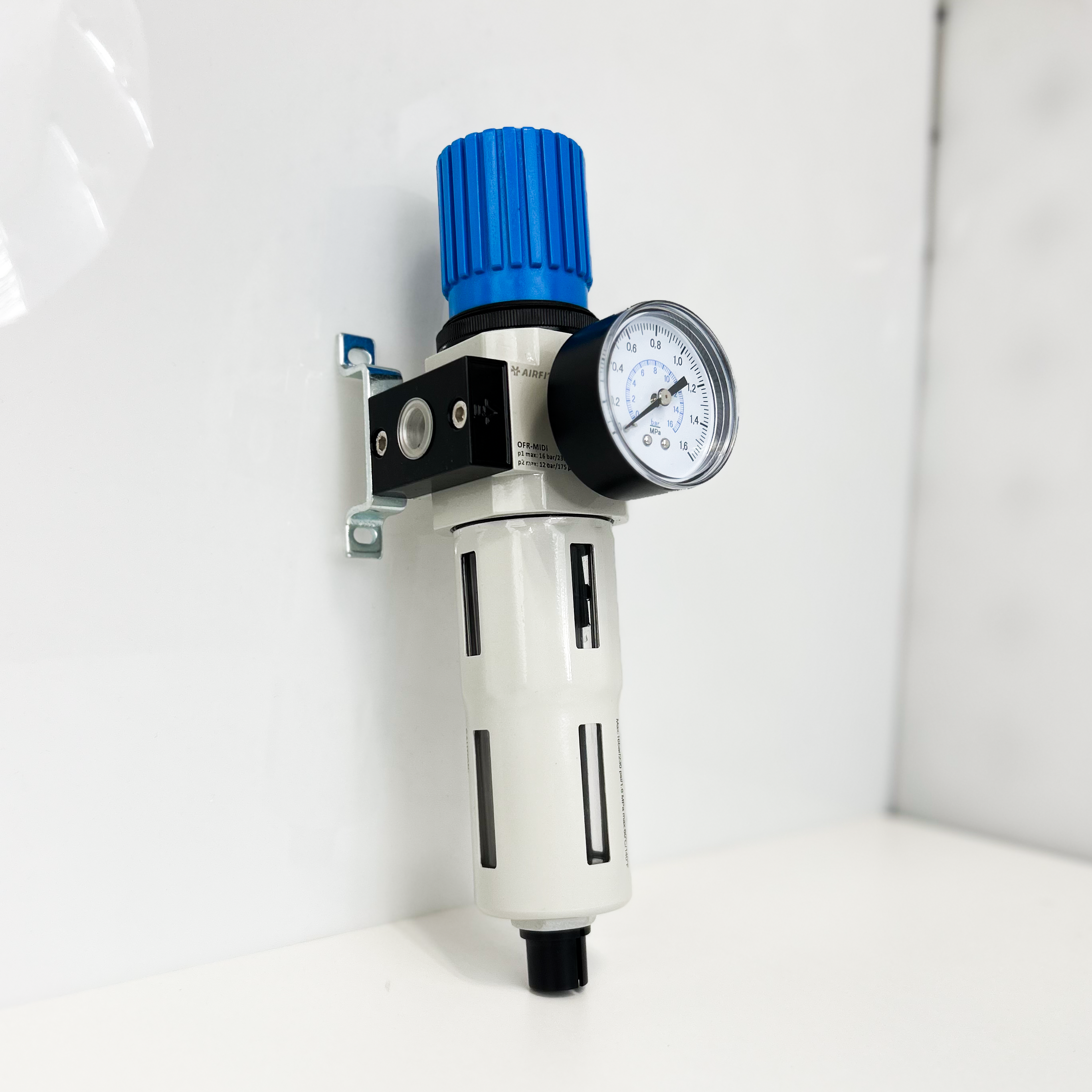 Air filter with blue top and gauge on a white background