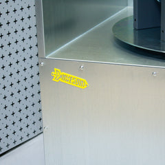 Industrial ATEX spray booth with turntable and yellow nukeson logo badge on white and black pegboard background