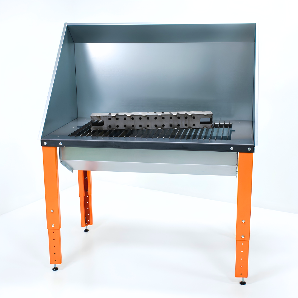 Plasma cutting table with perforated work surface on a white background