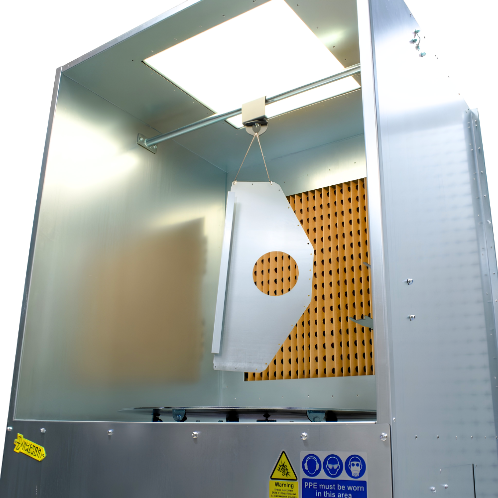 Industrial ATEX spray booth with turntable on white background with hanging item on hanging bar