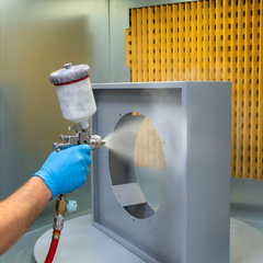 Industrial ATEX spray booth close up with turntable and spray gun