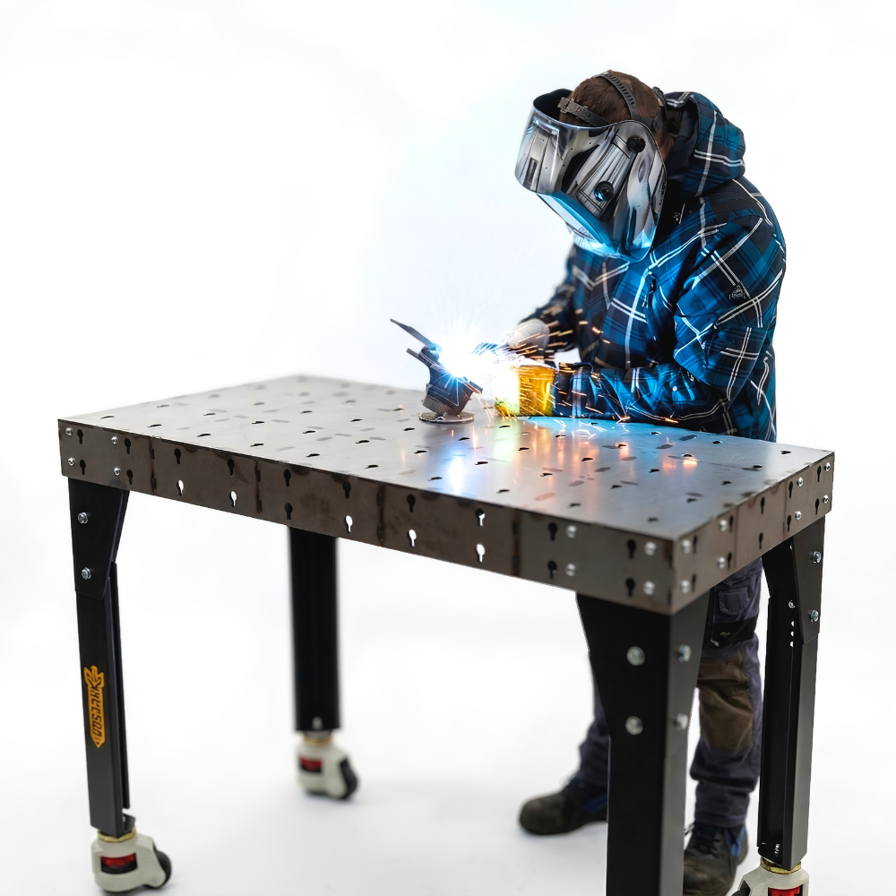 Welder using a welding table with black legs in a white background