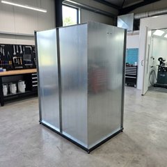 A galvanised steel canopy used for paint drying in a car paint body shop garage.