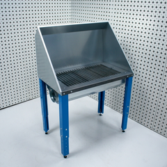 Plasma cutting table with perforated work surface on a white background