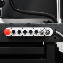 WeldBot control panel with emergency stop button and selector switches on  welding workstation