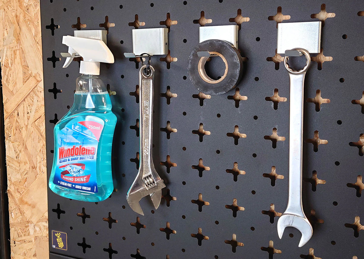 four Nukeson galvanised steel grinder disc bracket with a universal hook attachment, with various tools, mounted on a black organiser