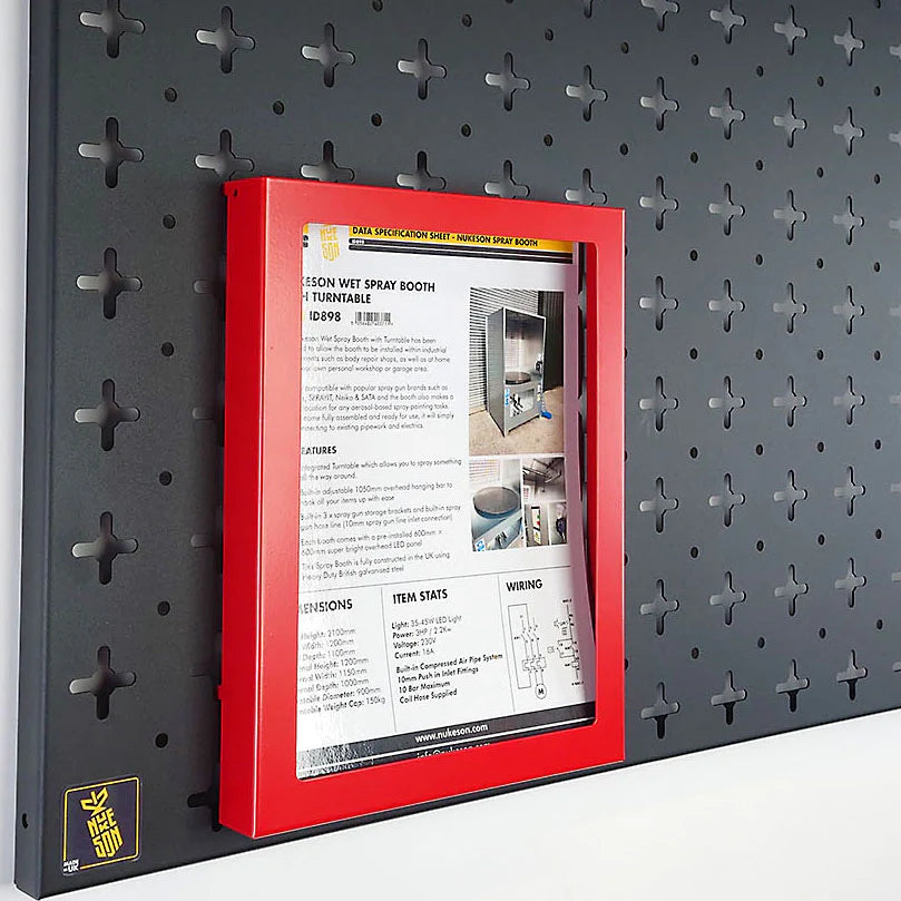 paper tray, in red with paper in, mounted on a black pegboard organiser wall by Nukeson