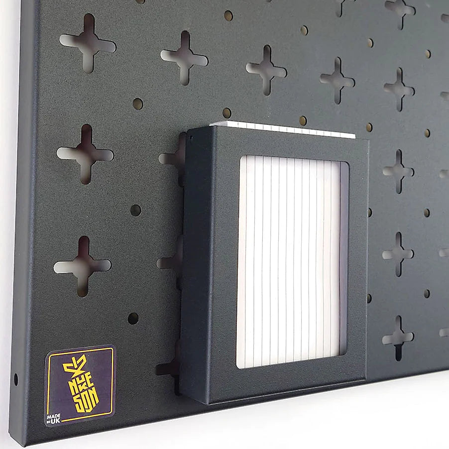 A6 paper tray, in black with paper in, mounted on a black pegboard organiser wall by Nukeson